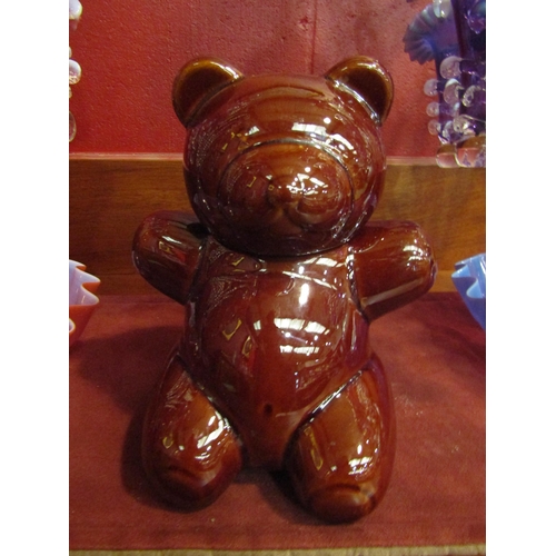 4154 - An Aramis brown glazed bear pot, 20cm tall