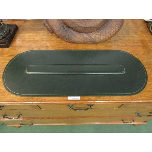 4177 - An Asprey London green and gilt leather desk arm rest, 52cm long