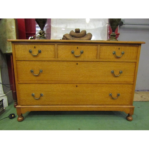 4178 - An Edwardian light oak chest of three short over two long drawers having oak linings, the raised ups... 