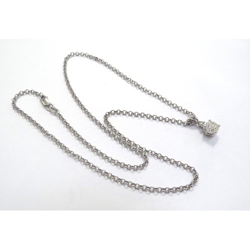9136 - A two stone diamond drop pendant, one round brilliant cut stone 1.08ct approx in four claws with 0.0... 