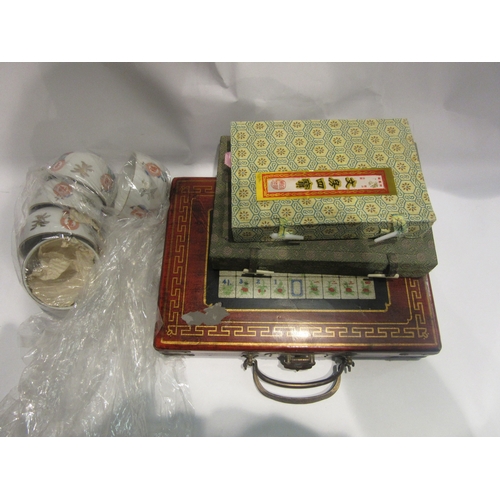 4448 - A cased Mahjong set, brand new still wrapped pieces, together with two calligraphy sets and Oriental... 