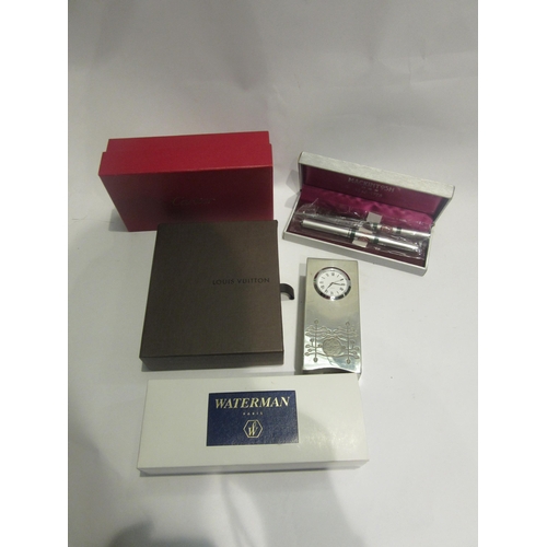 4431 - A Charles Rennie Mackintosh pewter clock, with inscription to top, pen set and empty boxes including... 