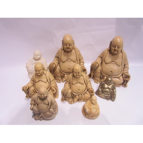 4477 - Eight Buddha figures, most resin and one brass