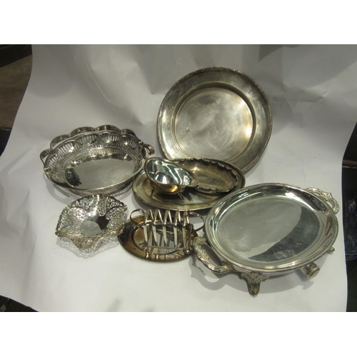 4481 - A box of miscellaneous plated ware to include entrée dishes, cake basket, five bar toast rack, sauce... 