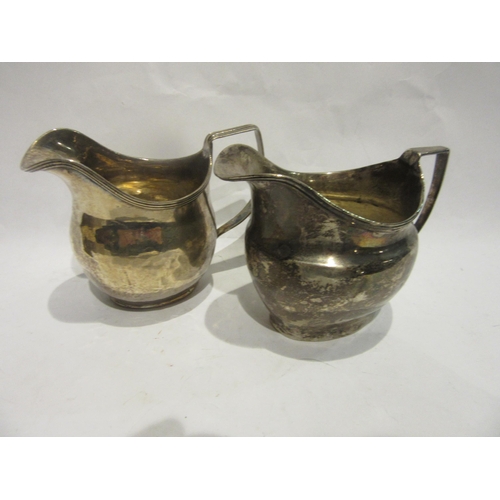 4490 - Two George III silver cream jugs, marks rubbed and jugs  dented, 153g