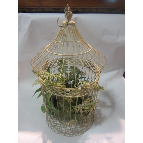 4007 - A wirework bird cage with plastic fern, 60cm tall