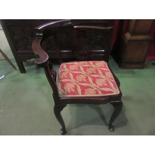 4012 - An Edwardian mahogany corner chair the scroll arms over pierced splat supports on pad foot cabriole ... 