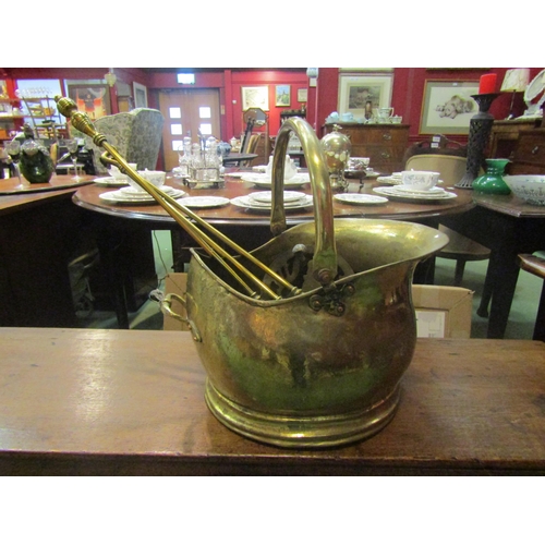 4168 - A brass coal bucket, fire companions and trivet