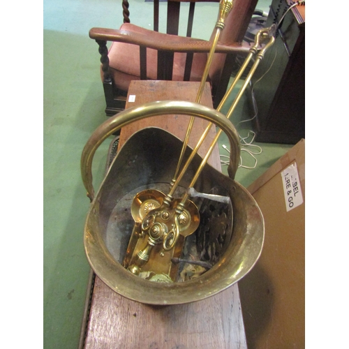 4168 - A brass coal bucket, fire companions and trivet