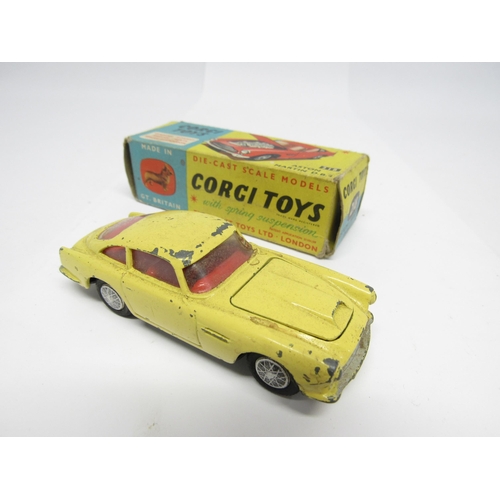 9415 - Three boxed Corgi Toys diecast model cars to include 218 Aston Martin DB4 in yellow with red interio... 