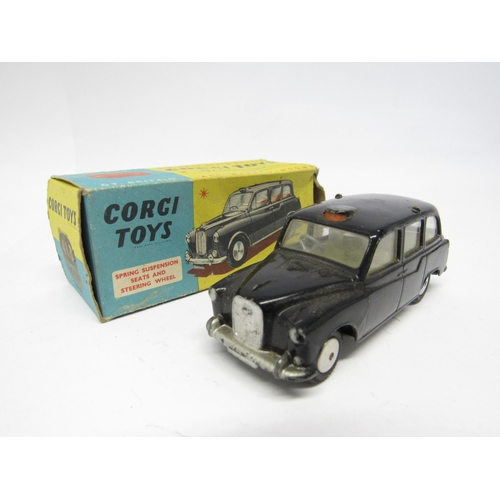 9415 - Three boxed Corgi Toys diecast model cars to include 218 Aston Martin DB4 in yellow with red interio... 