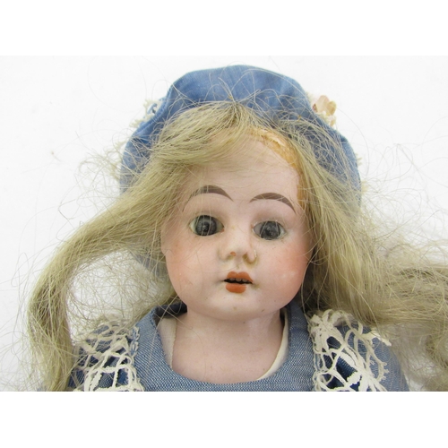 9312 - An early 20th Century bisque shoulder head girl doll with blonde wig, fixed glass eyes and painted f... 