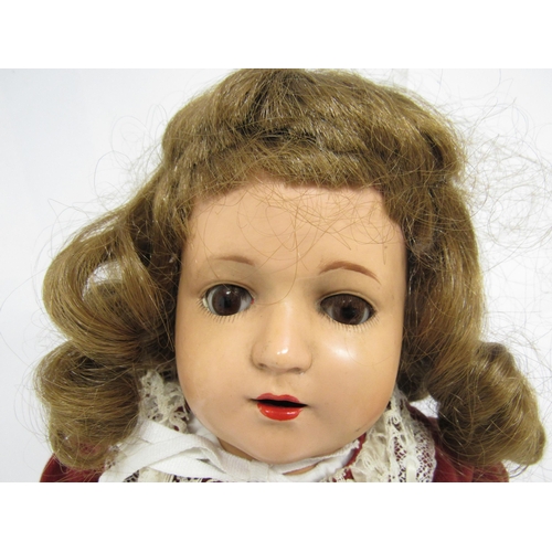 9230 - A vintage hard plastic girl doll with brown wig and brown glass sleeping eyes, on articulated kid bo... 