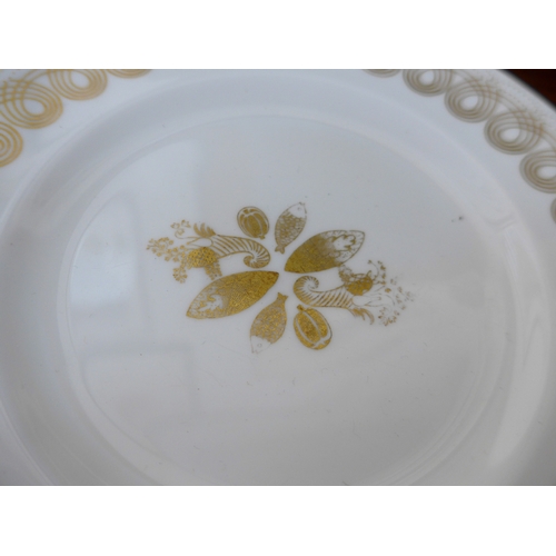 7039 - Eric Ravilious for Wedgwood - A collection of 'Golden Persephone' dinner and tea wares, some plain, ... 