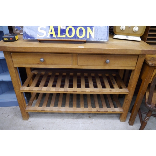 2081 - An oak drawer side table server with slatted under tier 4' wide