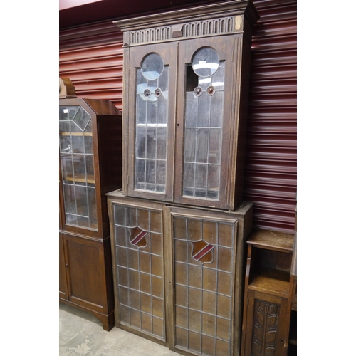 2113 - Two Edwardian lead-glazed oak cabinets, both a/f