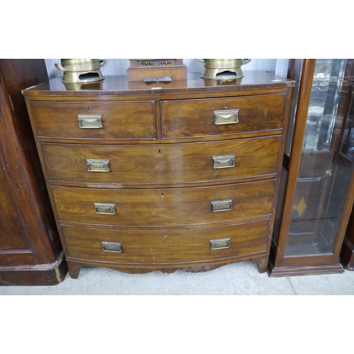 2128 - A Victorian flame mahogany bow front chest of two short over three long drawers, brass handles, some... 