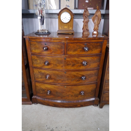 2130 - A Victorian Scottish mahogany chest of two short over three long drawers, bow front, bun handles, pl... 