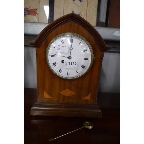 2132 - An early 20th Century mahogany mantel clock, inlaid with satinwood marquetry, 34cm high