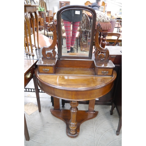 2168 - A small Victorian mahogany demi lune dressing table