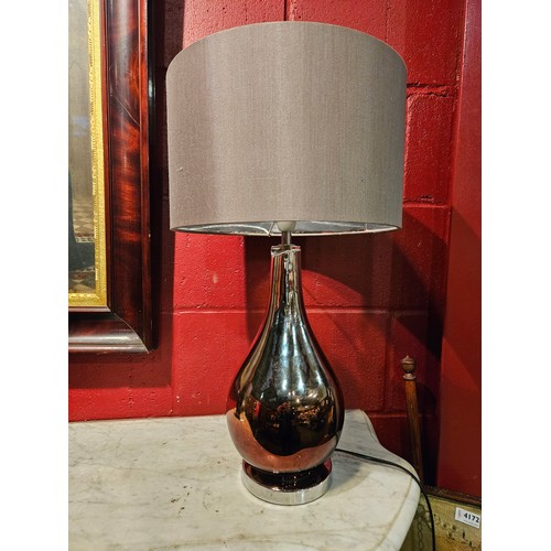 4163 - A pair of mirror effect bulbous form lamps