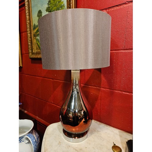 4163 - A pair of mirror effect bulbous form lamps