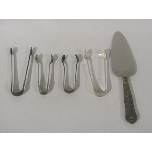 4420 - A silver handled cake slice, three silver tongs and a plated pair