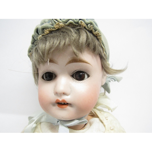 9309 - An early 20th Century Felix Arena Mignon bisque head girl doll with light brown wig, brown glass sle... 