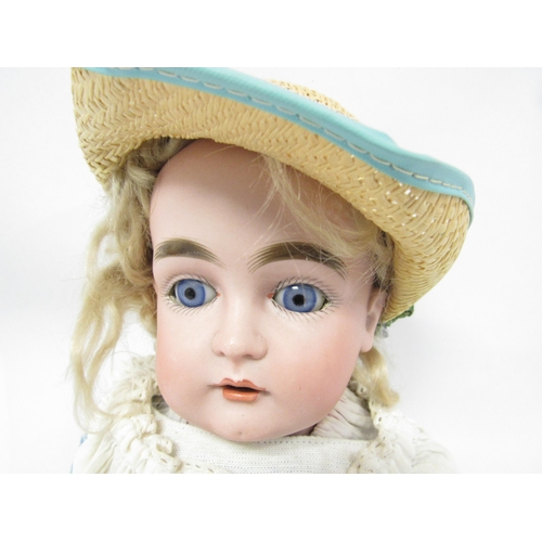 9319 - An early 20th Century bisque head girl doll with blonde wig, blue glass sleeping eyes, painted featu... 