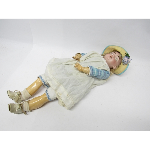 9319 - An early 20th Century bisque head girl doll with blonde wig, blue glass sleeping eyes, painted featu... 