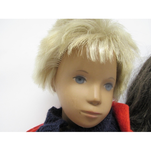 9317 - A group of three Trendon Sasha dolls to include Gregor boy with blonde hair in original blue knitted... 