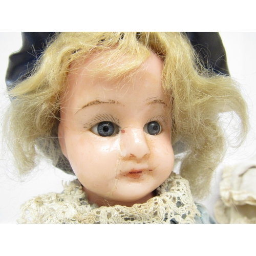 9236 - Two late 19th / early 20th Century poured wax dolls, each with blonde hair, fixed blue glass eyes an... 