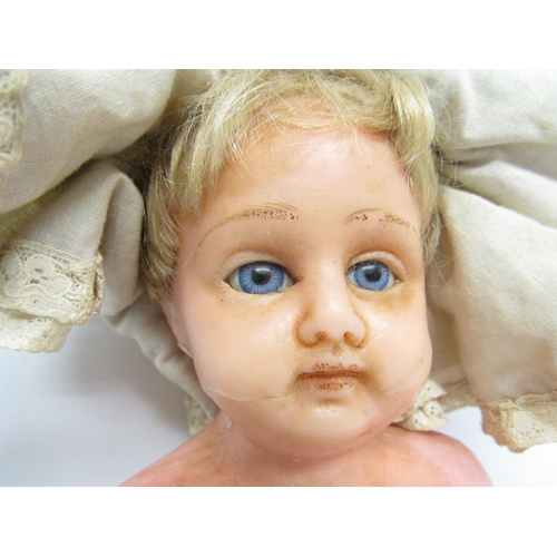 9236 - Two late 19th / early 20th Century poured wax dolls, each with blonde hair, fixed blue glass eyes an... 