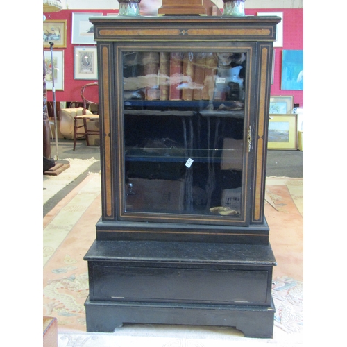 1070 - A Victorian ebonised pier cabinet with shelved interior on base with drop-flap and bracket feet, los... 