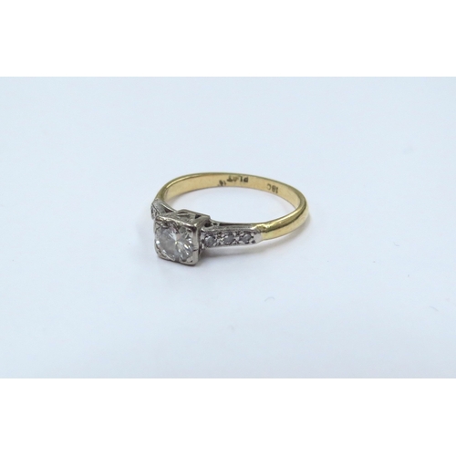 9154 - An 18ct gold platinum set diamond ring, 0.25ct approx with three diamonds set to each shoulder. Size... 