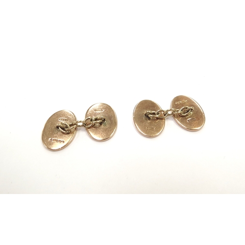 9177 - A pair of 9ct rose gold gentleman's cufflinks, oval form, with engine-turned detail, 12.6g