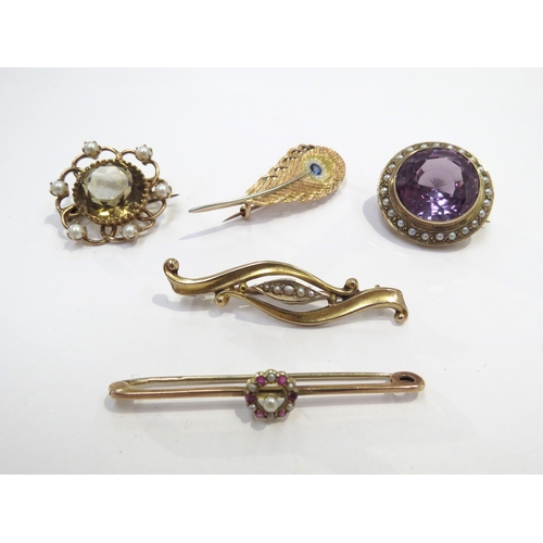 9402 - An amethyst and seed pearl brooch, citrine and seed pearl brooch, Peacock feather pin set with a sin... 