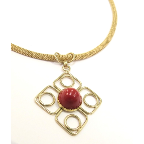 9068 - A gold fine woven chain necklace stamped 750 with a square form pendant with a central cabochon cora... 