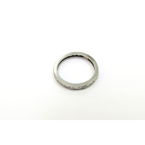 9096 - A diamond eternity ring, resized, unmarked Size N, 2.8g