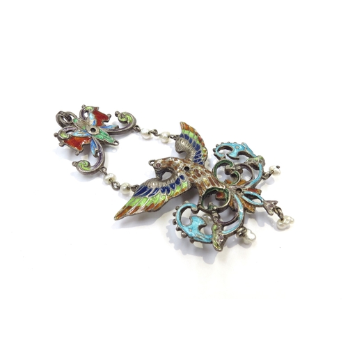 9393 - An Austro\Hungarian enamelled pendant of a bird with outstretched wings studded with pearls and gree... 