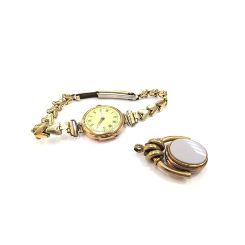 9278 - A 9ct gold cased wristwatch with a plated strap and a plated swivel fob with hinged opening revealin... 