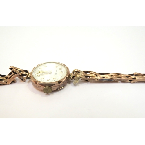 9365 - A 9ct gold wristwatch with gold strap, 18.1g total