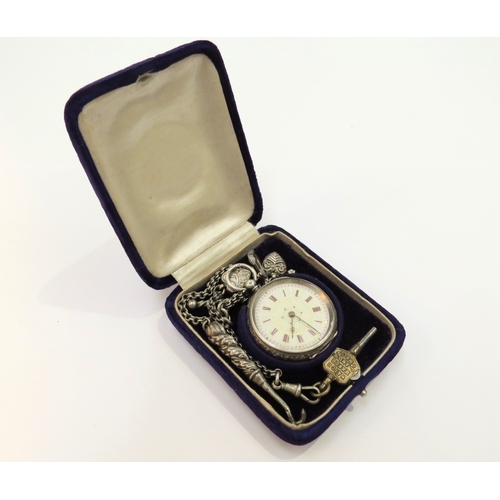 9286 - A silver fob watch with chain and charms, boxed