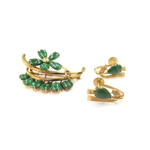 9144 - A Jade set floral brooch stamped 14k and a pair of 14k jade screw-back earrings, 10g total