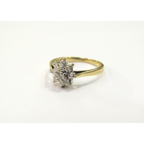 9126 - An 18ct gold diamond daisy ring. Size M, 2.8g