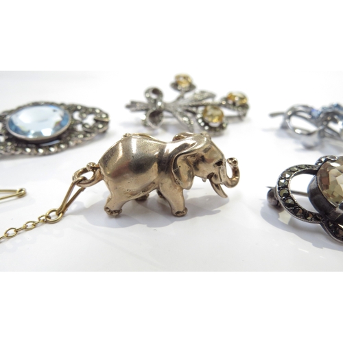 9362 - A silver brooch as an elephant and four other costume brooches including silver examples (5)