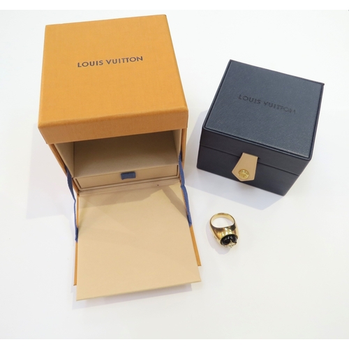 9063 - LOUIS VUITTON; An 18ct yellow gold Blossom Signet Ring, Onyx and Diamond set domed cabochon. Size J/... 