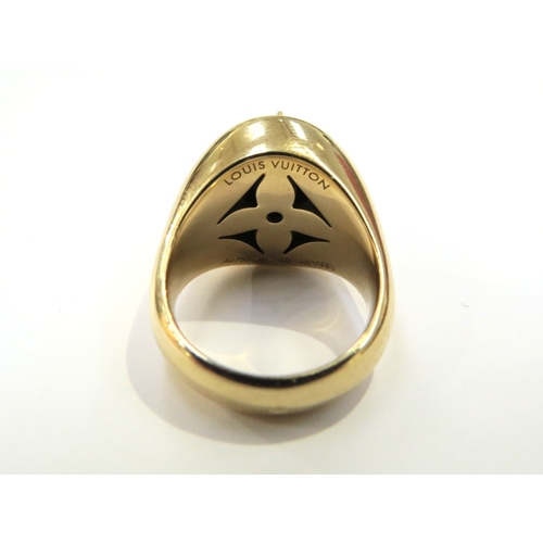 9063 - LOUIS VUITTON; An 18ct yellow gold Blossom Signet Ring, Onyx and Diamond set domed cabochon. Size J/... 