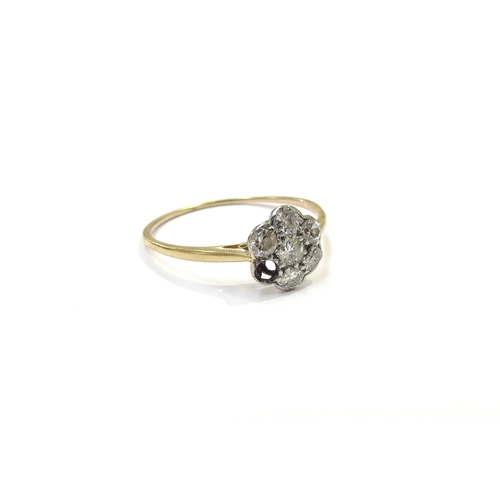 9228 - A diamond daisy ring, one diamond missing, shank unmarked. Size S, 1.4g