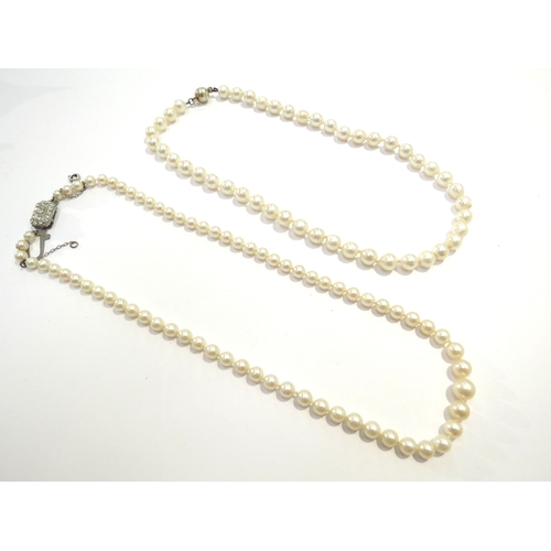 9429 - An irregular shaped cultured pearl necklace, 40cm long with magnetic clasp and a single strand gradu... 